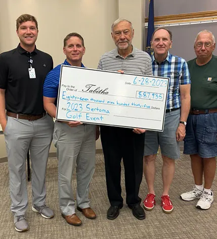 Harold Klein (center) and members of the Gateway Sertoma Club present the Tabitha Foundation with a check from the 2023 golf event.
